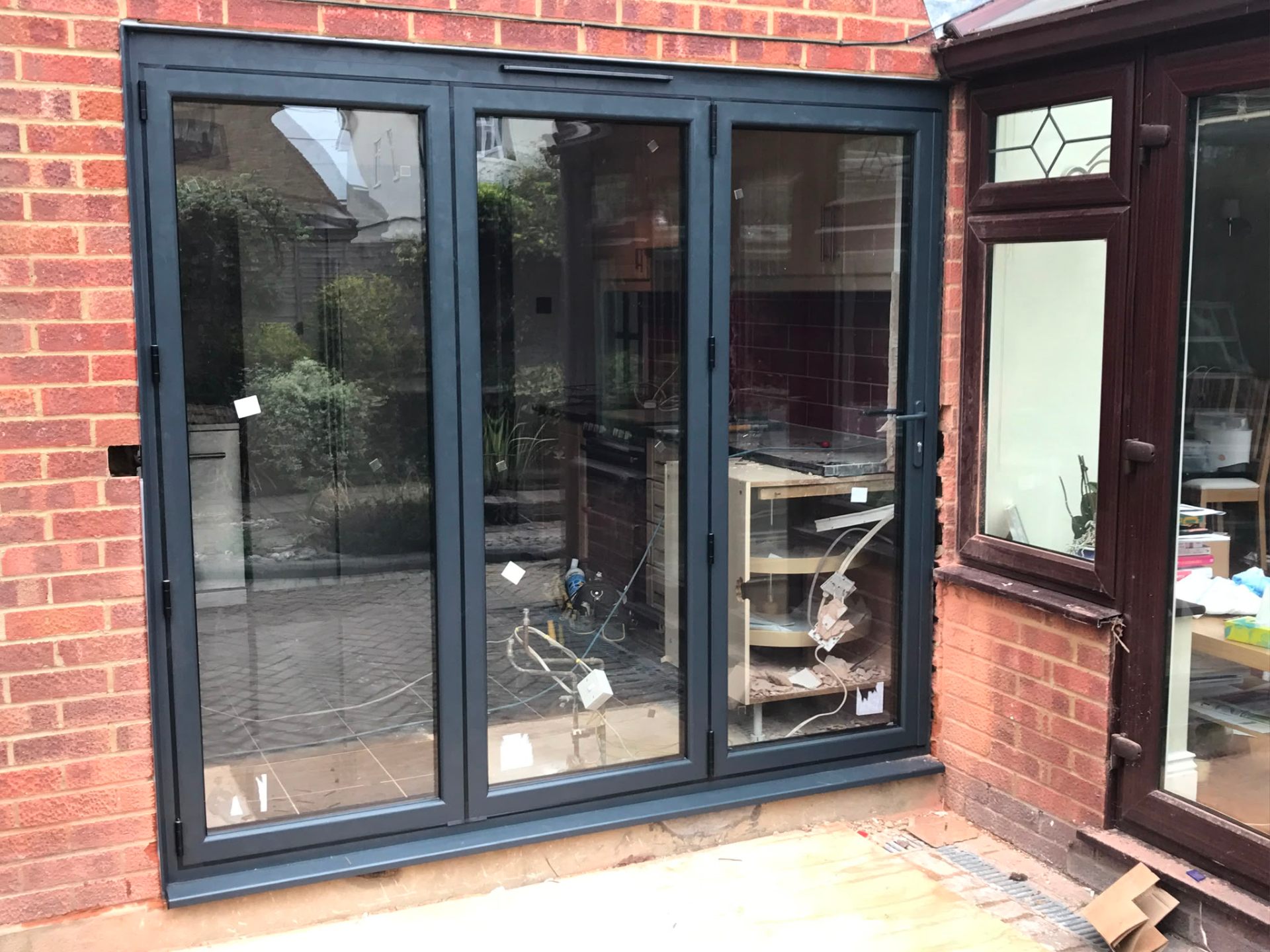 Aluminium bi-fold doors installation by Rural Windows in Chester & North Wales