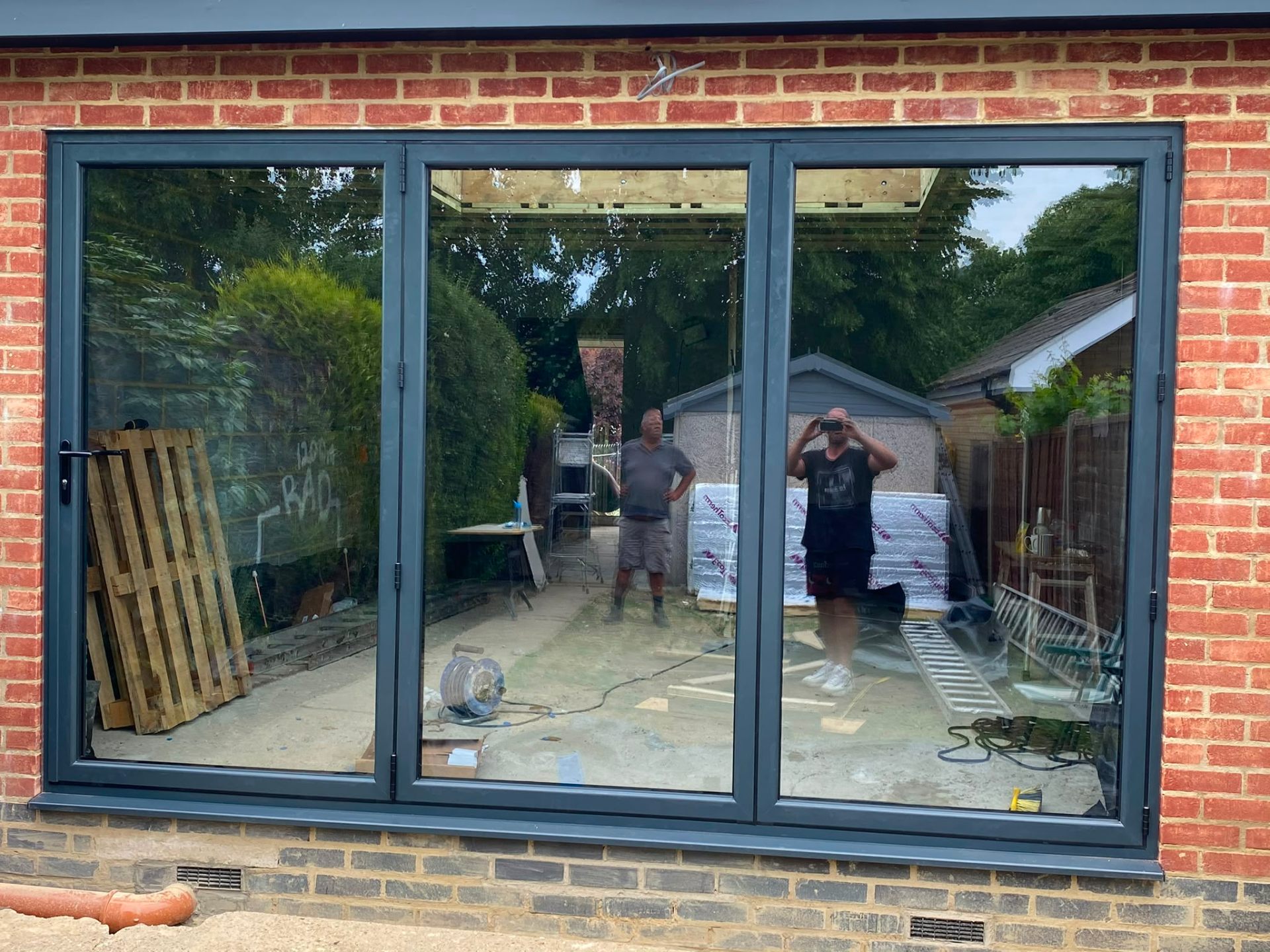 Aluminium bi-fold doors installation by Rural Windows in Chester & North Wales
