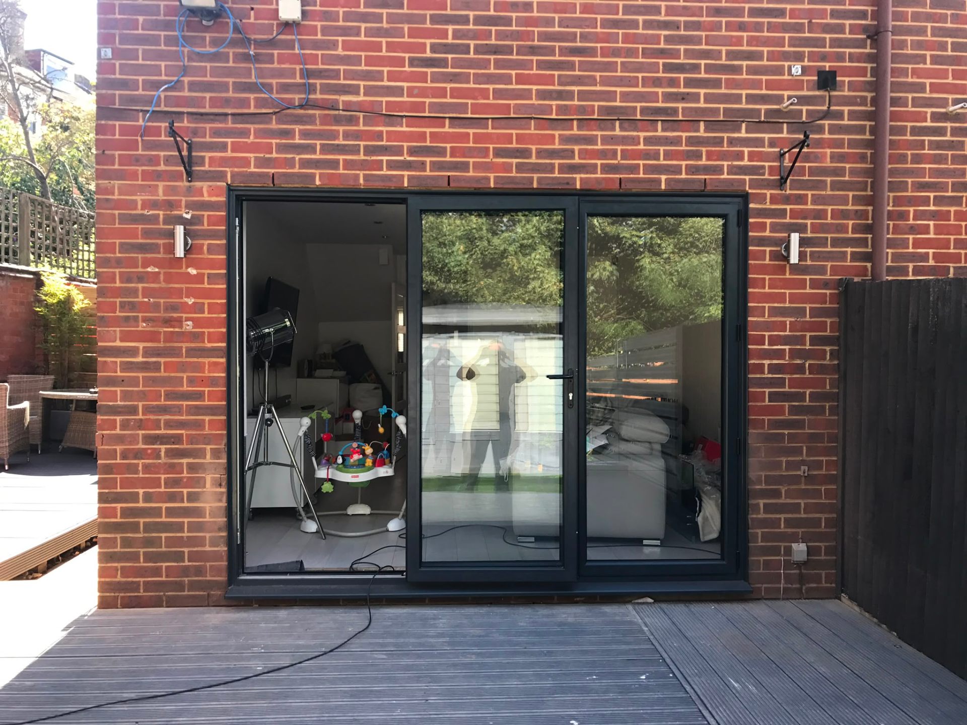 Aluminium bi-fold doors installation by Rural Windows in Chester & North Wales