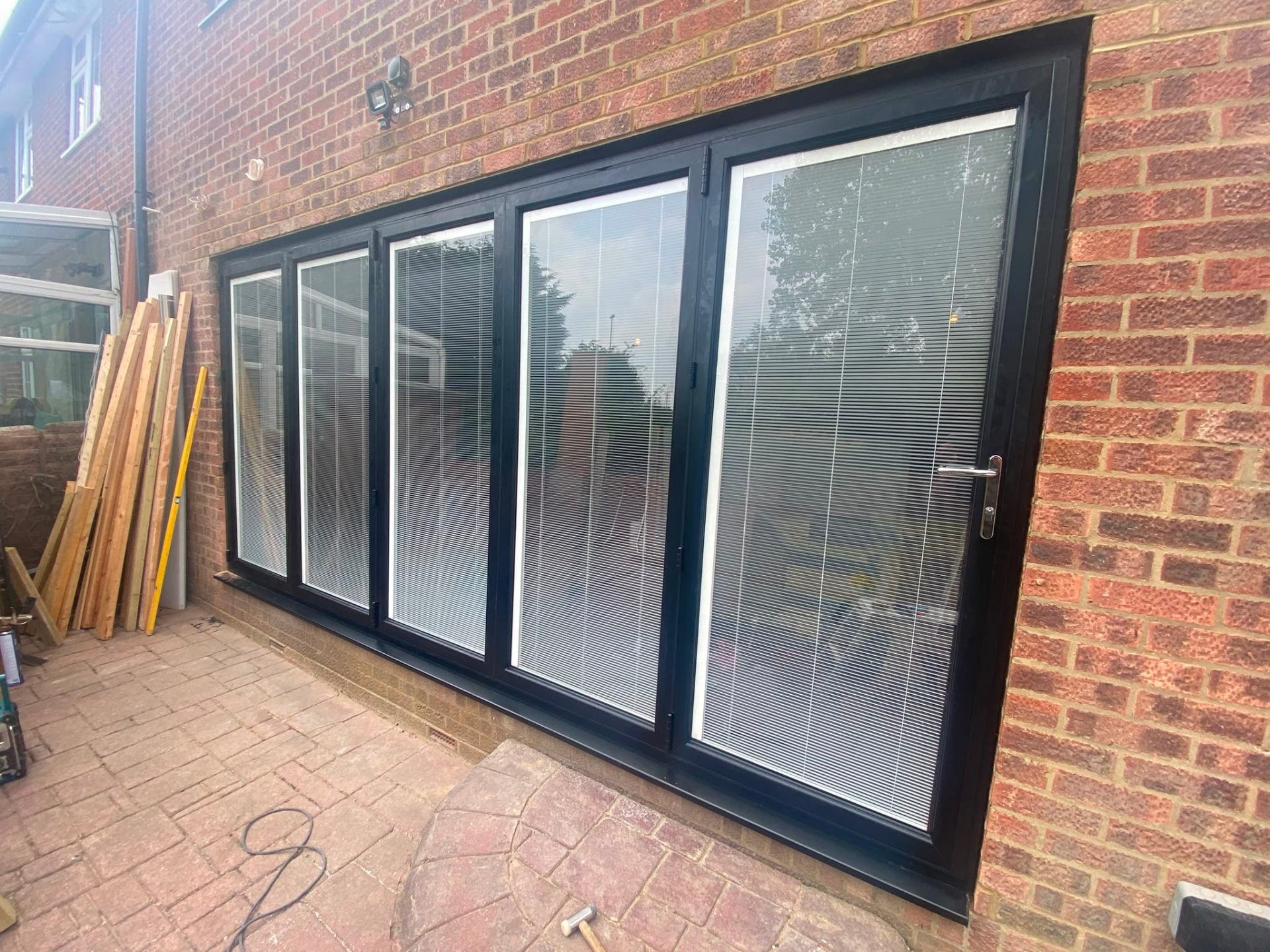 Aluminium bi-fold doors installation by Rural Windows in Chester & North Wales