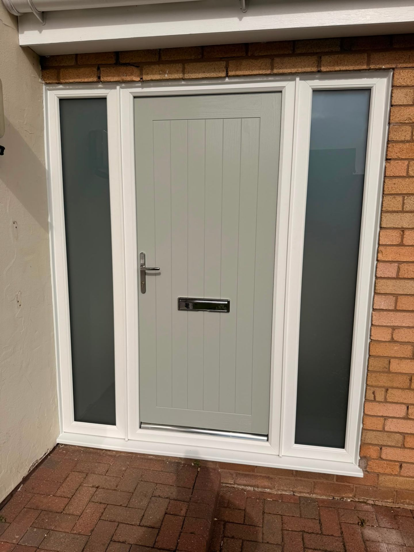 Chartwell green composite front door with white frame and two glazed side panels