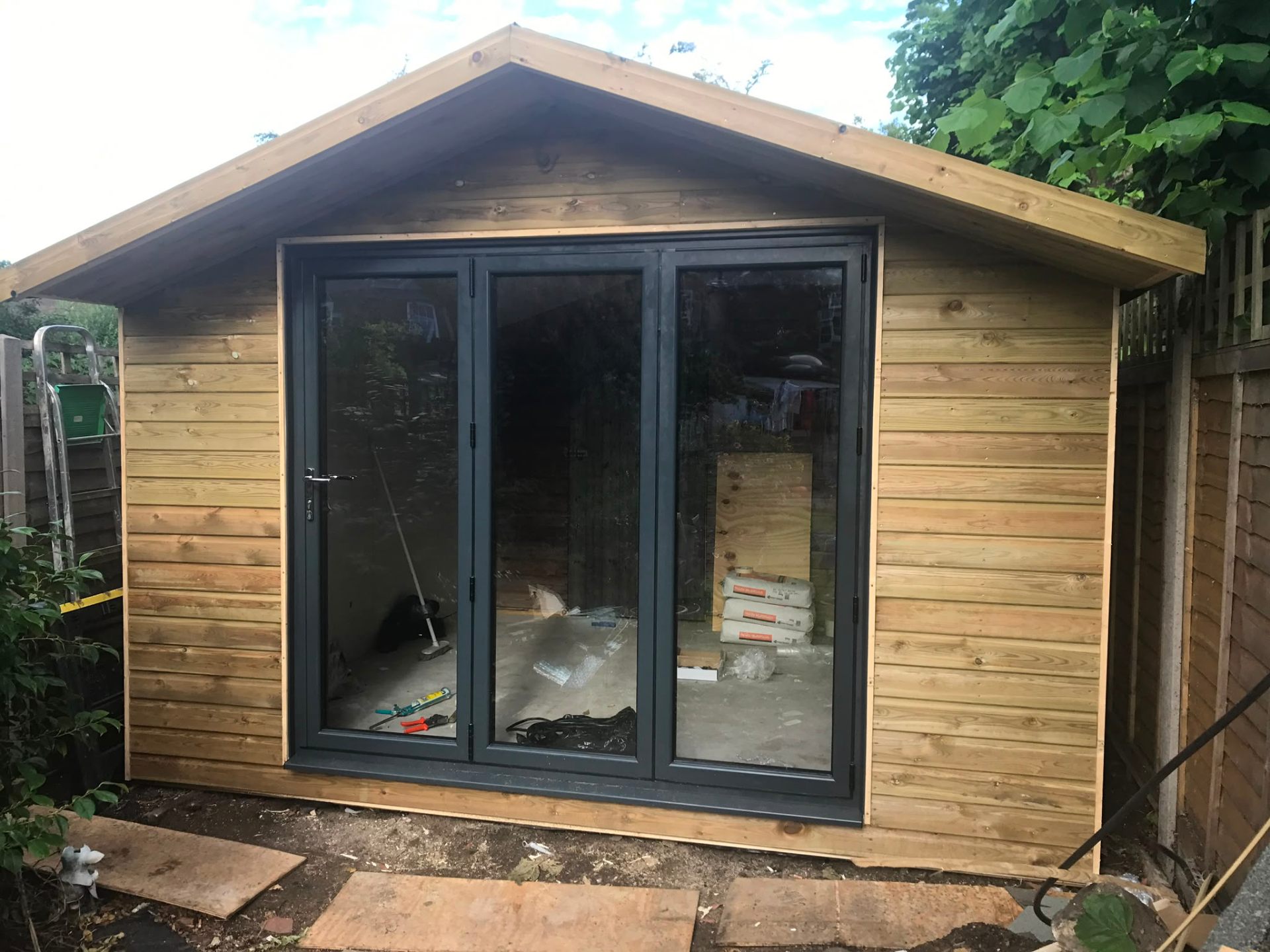 Aluminium bi-fold doors installation by Rural Windows in Chester & North Wales