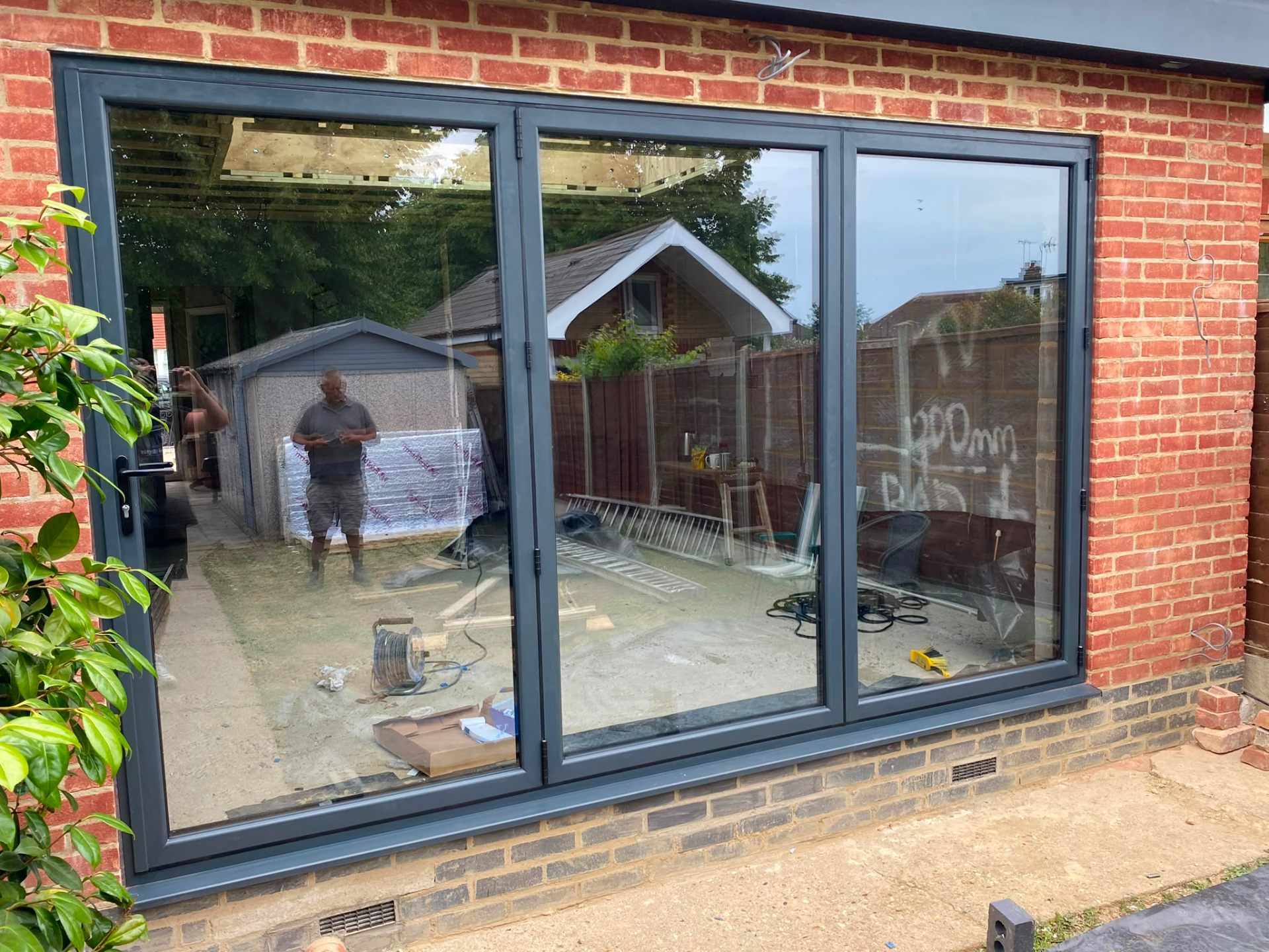 Aluminium bi-fold doors installation by Rural Windows in Chester & North Wales